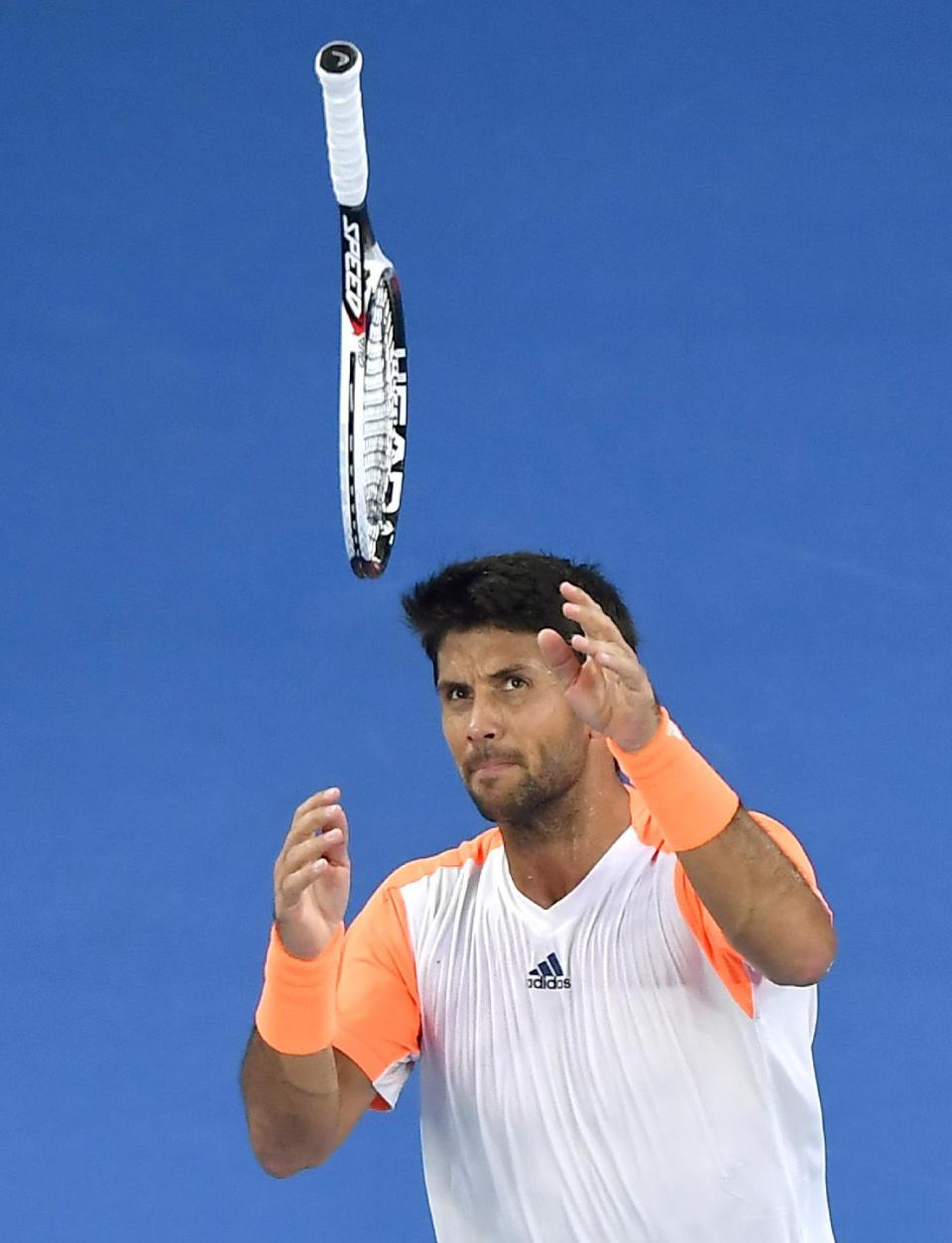 Spain's Fernando Verdasco throws his racket in frustration while playing Serbia's Novak Djokovic in their first round match at the Australian Open tennis championships in Melbourne, Australia, Tuesday, Jan. 17, 2017. (AP Photo/Andy Brownbill)