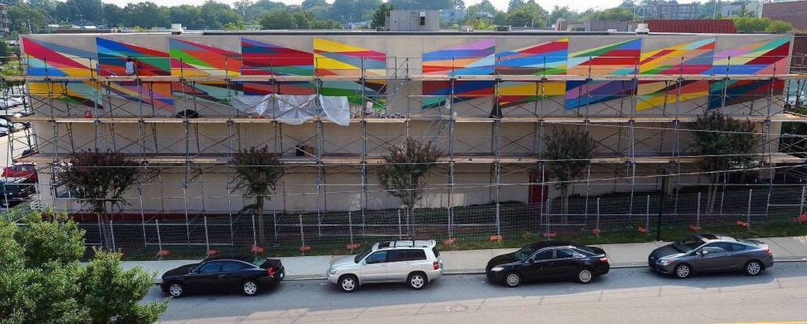 A mural by Odili Donald Odita on the side of the downtown branch of the Durham YMCA nears completion Friday, Sept. 4, 2015. Chuck Liddy/cliddy@newsobserver.com