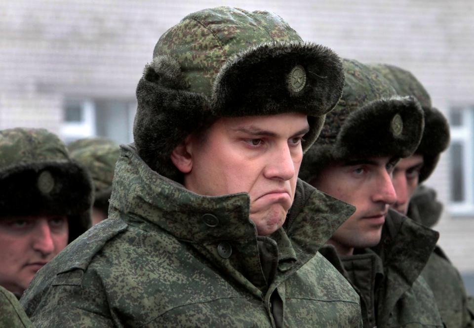 Conscripts stand at a military conscription office in Grozny, Chechnya's provincial capital, Russia, Monday, Nov. 17, 2014. 