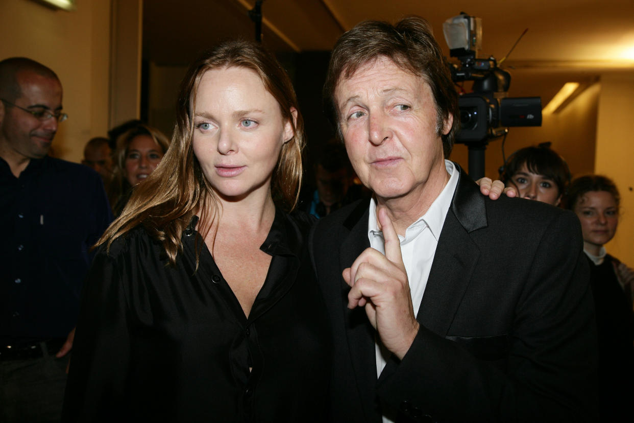 Sir Paul McCartney and his daughter Stella backstage, after Stella McCartney Spring/Summer 2008 collection fashion show during Paris Fashion Week.  (Photo by Stephane Cardinale/Corbis via Getty Images)