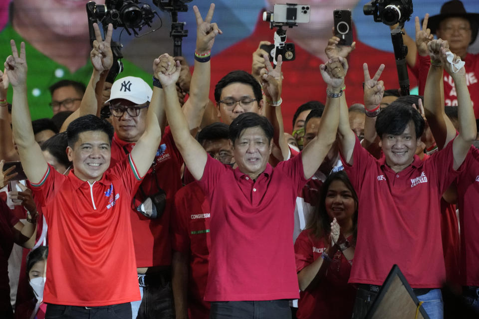 Ferdinand "Bongbong" Marcos Jr. gestures as he greets the crowd during a campaign rally in Quezon City, Philippines on April 13, 2022. Marcos Jr., son of the late dictator and his running mate Sara, who is the daughter of the outgoing President Rodrigo Duterte, are leading pre-election surveys despite his family's history. (AP Photo/Aaron Favila)