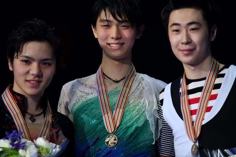 (L-R) Shoma Uno, Yuzuru Hanyu and Boyan Jin pose with their medals after the World Figure Skating Championships in Helsinki, on April 1, 2017