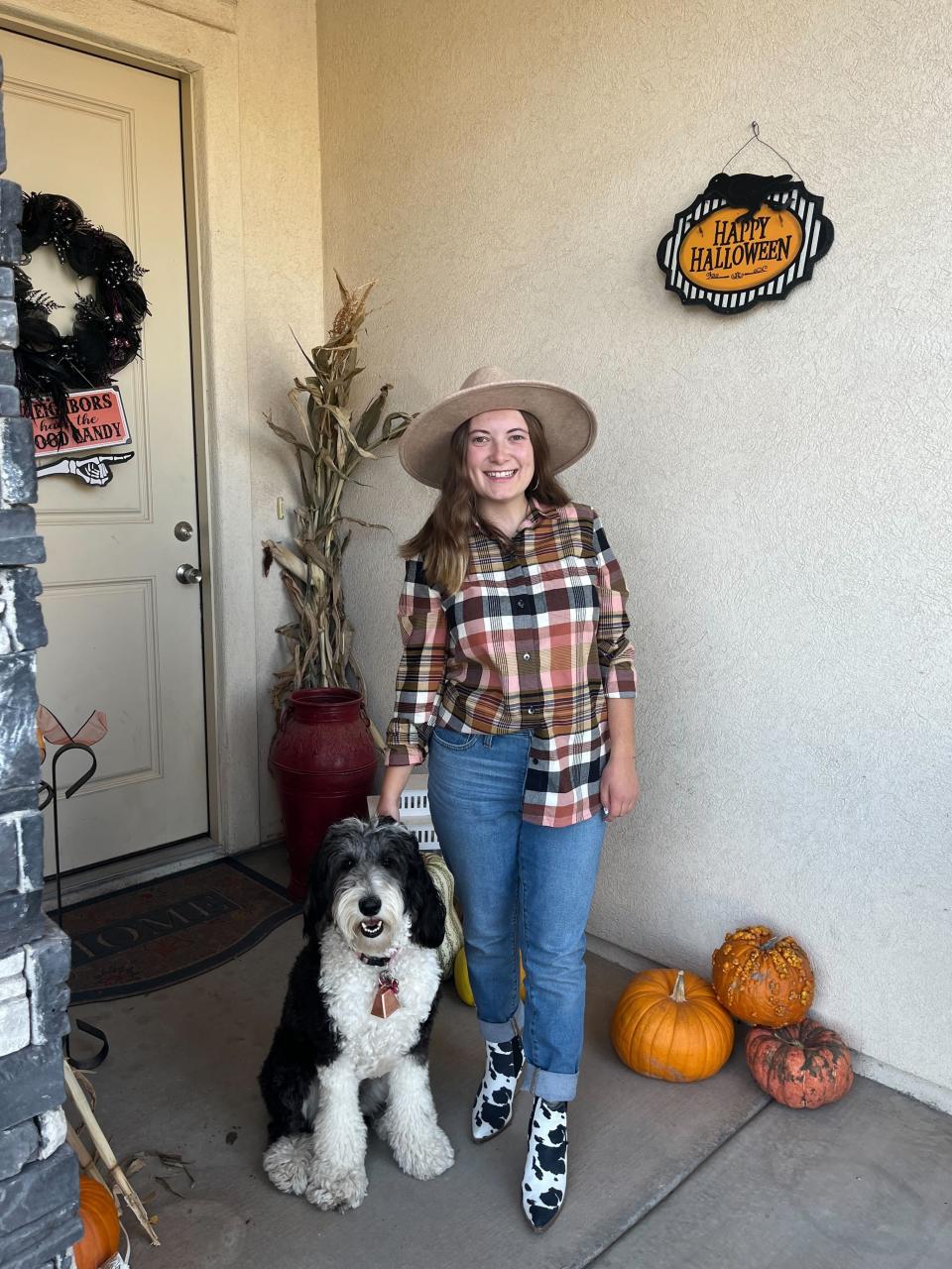 Caroline Peterson with Nala, dressed as a cowgirl and cow for Halloween. A howl-oween, if you will. | Caroline Peterson