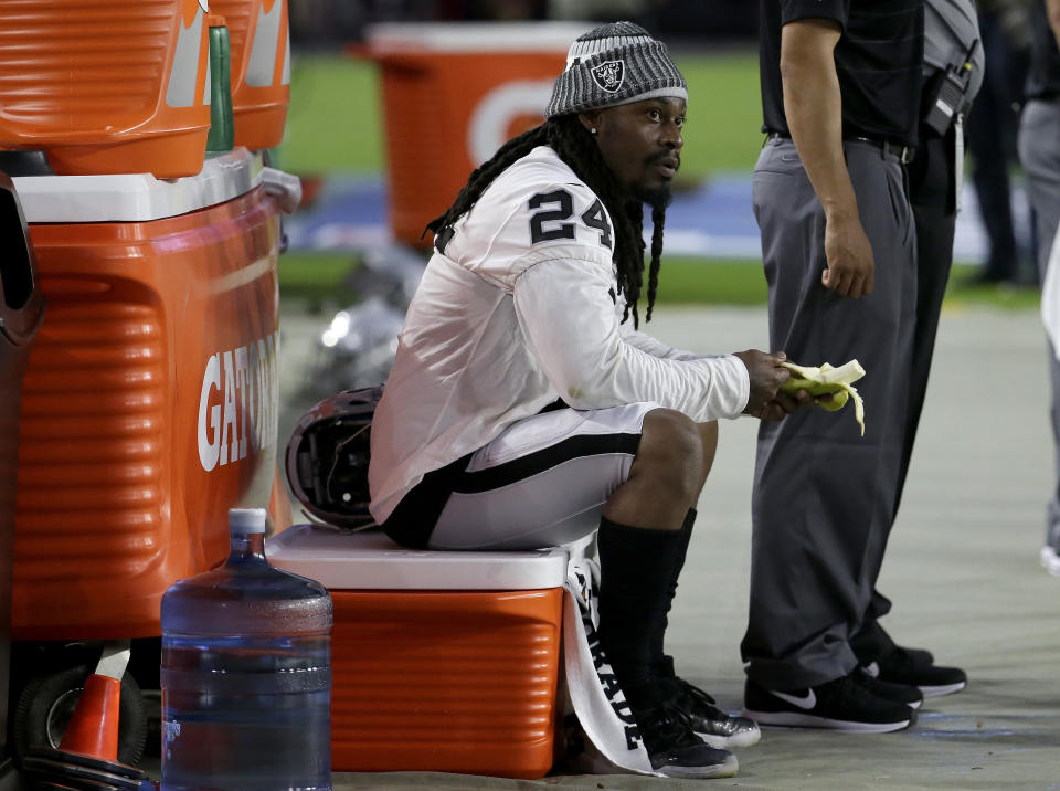 Oakland RB Marshawn Lynch is seated during the national anthem at Saturday’s Raiders-Cardinals game. (AP)