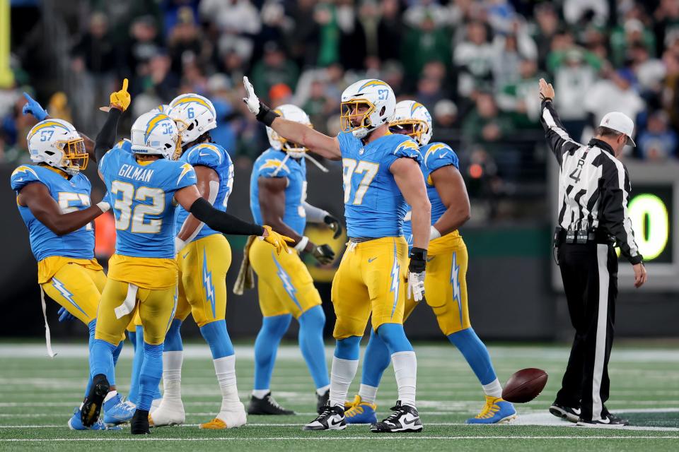 Nov 6, 2023; East Rutherford, New Jersey, USA; Los Angeles Chargers linebacker Joey Bosa (97) celebrates with teammates after recovering a New York Jets fumble during the first quarter at MetLife Stadium. Mandatory Credit: Brad Penner-USA TODAY Sports