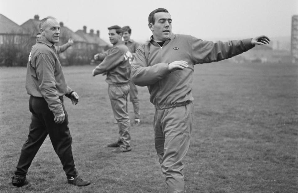 Ian St John warms up, watched by Liverpool’s manager Bill Shankly in January 1967