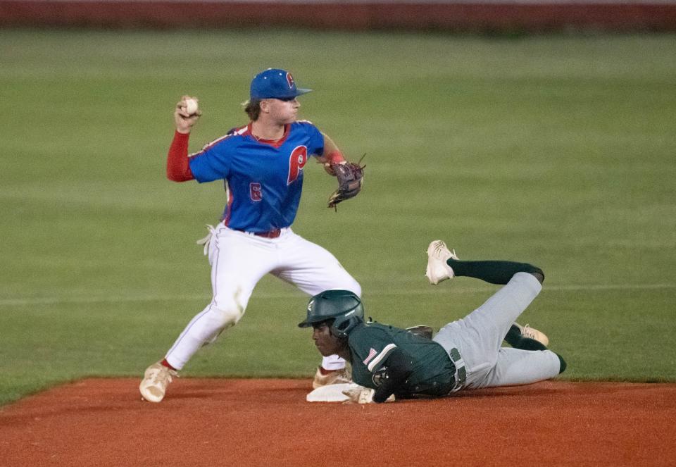 Pace's Tanner Owens (6) tags second base for the force out but holds the throw for the double play attempt against Fleming Island on Tuesday night.