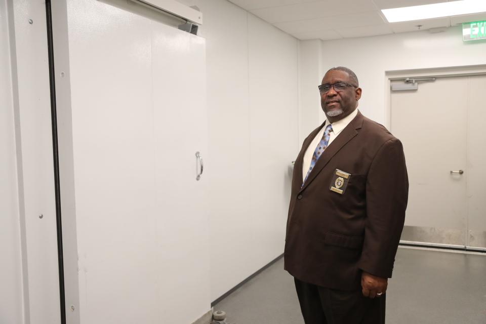 Chatham County Coroner David Campbell stands outside the refrigerated morgue at the the Chatham County Coroner's office in Garden City.