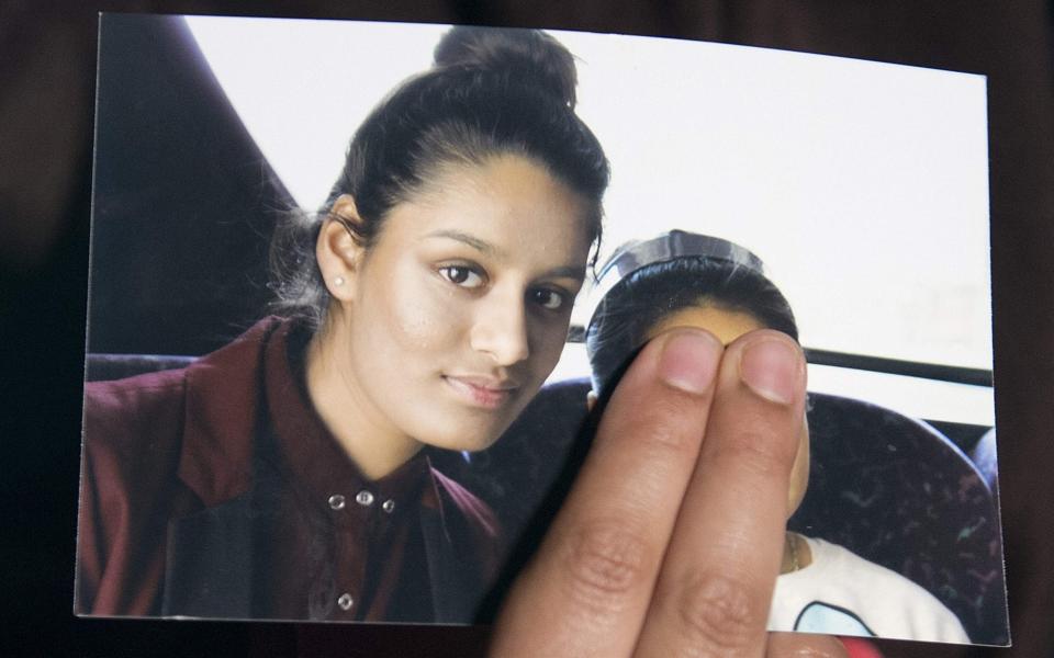 Renu Begum, eldest sister of missing British girl Shamima Begum, holds a picture of her sister  - AFP/Getty