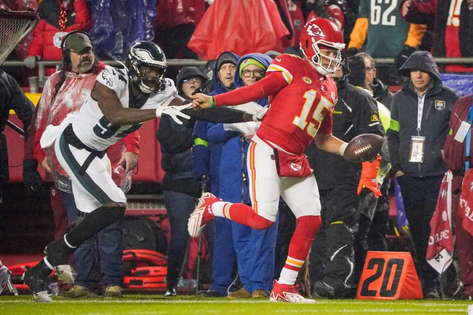 Nov 20, 2023; Kansas City, Missouri, USA; Kansas City Chiefs quarterback Patrick Mahomes (15) runs the ball as Philadelphia Eagles defensive end Josh Sweat (94) chases during the first half at GEHA Field at Arrowhead Stadium. Mandatory Credit: Denny Medley-USA TODAY Sports