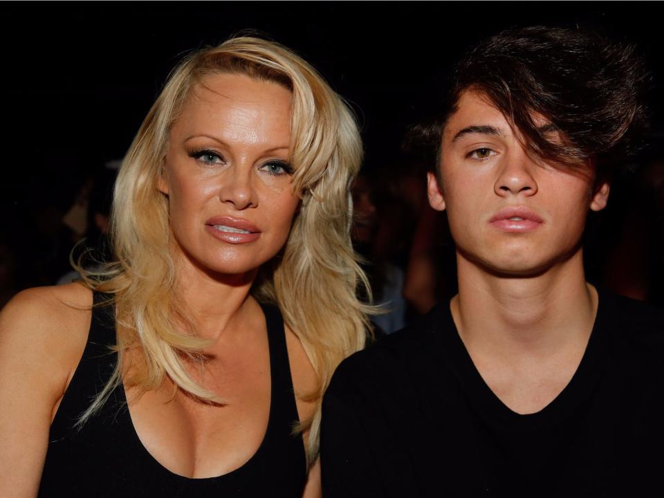 Pamela Anderson and her son Dylan Jagger Lee attend the Alexander Wang Spring 2017 fashion show during New York Fashion Week September 2016 at Pier 94 on September 10, 2016 in New York City