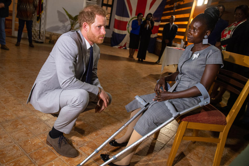 The Duke of Sussex meets landmine victim Sandra Tigica, who Princess Diana met on her visit to Angola 1997, during a reception at the British Ambassadors Residence in Luanda, Angola, on day five of the royal tour of Africa.