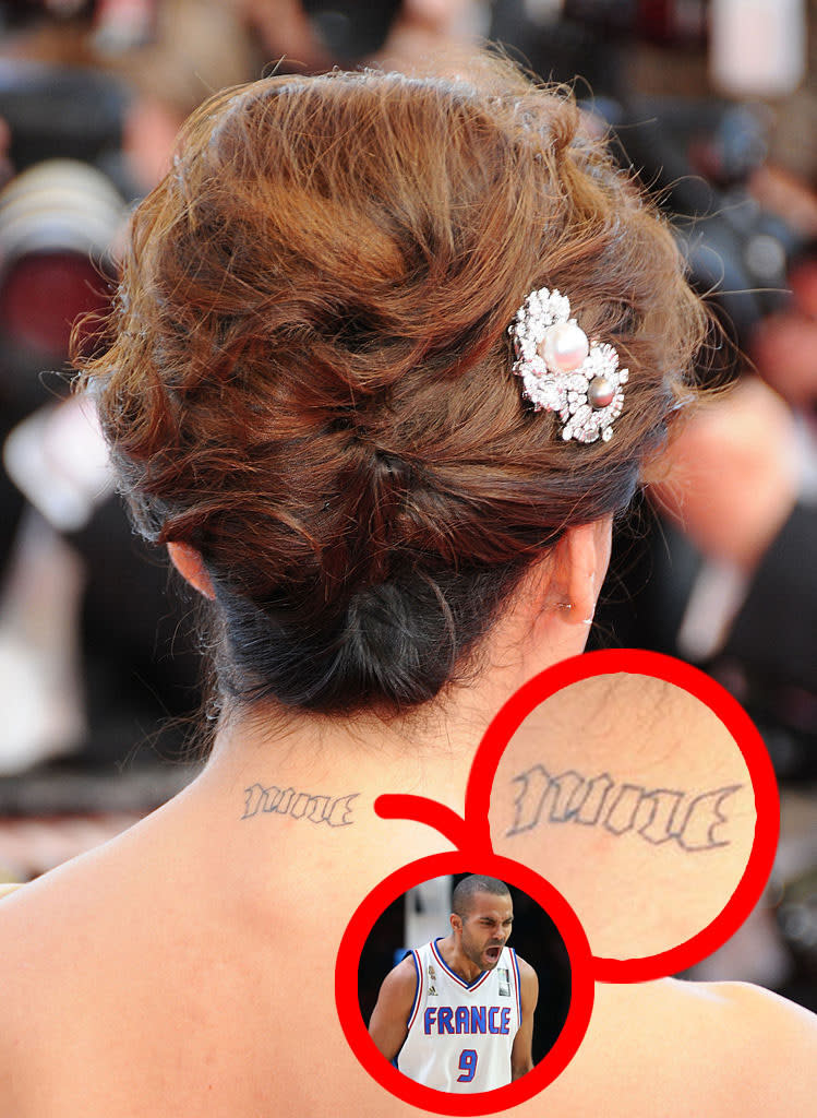 Eva Longoria's neck with the word, "Nine" tattooed on it