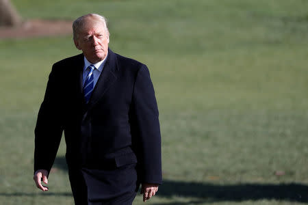 U.S. President Donald Trump walks as he returns to the White House after a trip to Lewisburg, West Virginia, in Washington D.C., U.S., April 5, 2018. REUTERS/Carlos Barria