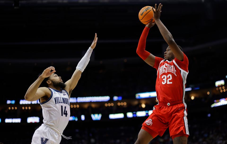 Mar 20, 2022; Pittsburgh, PA, USA; Ohio State Buckeyes forward E.J. Liddell (32) shoots the ball over Villanova Wildcats guard Caleb Daniels (14) in the first half during the second round of the 2022 NCAA Tournament at PPG Paints Arena. Mandatory Credit: Geoff Burke-USA TODAY Sports