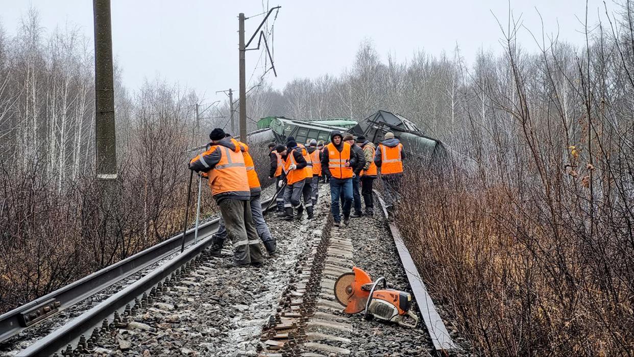 Russian Railways Company employees works at the side of derailed train carriages carrying cargo in Ryazan region, Russia. Train carriages carrying cargo in Russia’s Ryazan region were derailed Saturday morning due to “unauthorized interference