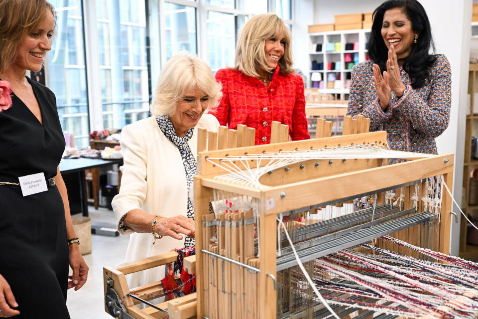 Britain's Queen Camilla, second left, and French President's wife Brigitte Macron, second right, next to CEO of Chanel Leena Nair, right, visit the 19M Campus, founded by the French luxury fashion house, Thursday, Sept. 21, 2023 in Paris. The royal couple's trip started Wednesday with a ceremony at Arc de Triomphe in Paris and a state dinner at the Palace of Versailles. King Charles will visit the Paris flower market named after his late mother, Queen Elizabeth II and rejoin Macron in front of Notre-Dame Cathedral to see the ongoing renovation work aimed at reopening the monument by the end of next year, after it was devastated by a fire in 2019. (Bertrand Guay, Pool via AP)