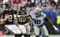 Dallas Cowboys defensive end Demarcus Lawrence (90) pressures Atlanta Falcons quarterback Matt Ryan (2) during the second half of an NFL football game, Sunday, Nov. 18, 2018, in Atlanta. (AP Photo/Danny Karnik)