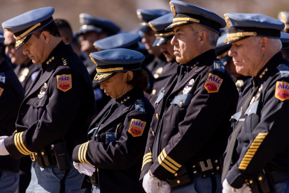 From left, Assistant Chief Humberto Talamantes, Assistant Chief Zina Silva, Assistant Chief Victor Zarur and Assistant Chief Peter Pacillas pray during El Paso police Chief Greg Allen's funeral ceremony at Evergreen Cemetery East El Paso on Friday, Jan. 27, 2023.