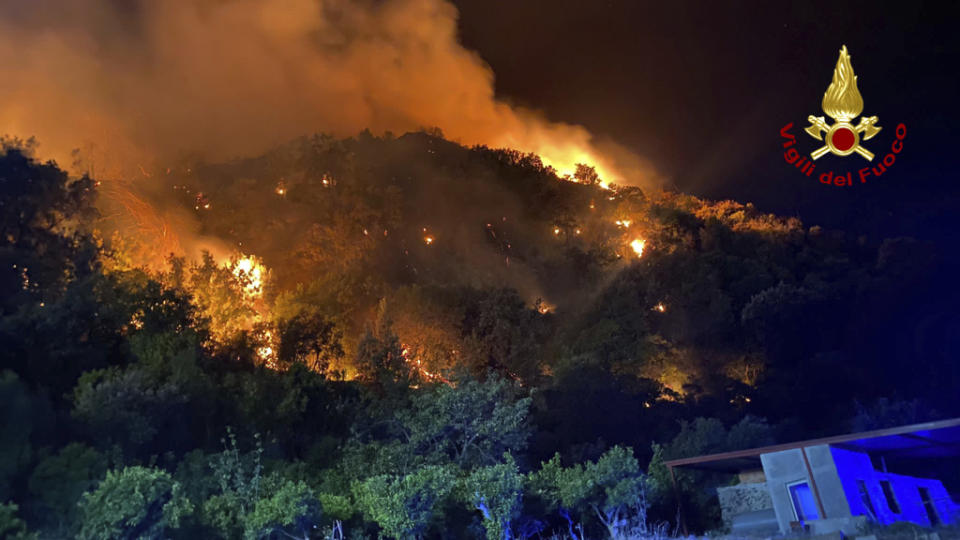 This picture released by the Italian firefighters shows wildfires in the region of Palermo in Sicily, Italy, Tuesday July 25, 2023. (Italian Firefighters - Vigili del Fuoco via AP)