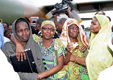 Freed hostages react as they arrive at the Nsimalen International Airport in Yaounde November 26, 2014. REUTERS/Stringer