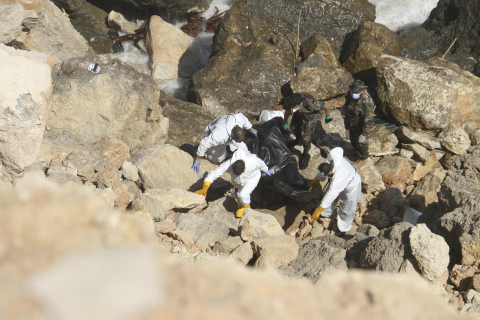 Rescue teams look for flash flood victims in the city of Derna, Libya, Monday, Sept. 18, 2023. Mediterranean storm Daniel caused flooding that overwhelmed two dams, sending a wall of water through the city. More than 10,000 were killed, and another 10,000 are missing. (AP Photo/Yousef Murad)