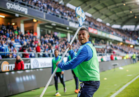 Malmo FF soccer player Tobias Sana (C) reacts after being hit by a large firecracker from the stands during the IFK Goteborg vs. Malmo FF match in Goteborg, Sweden April 27, 2016. TT News Agency/Adam Ihse/via REUTERS