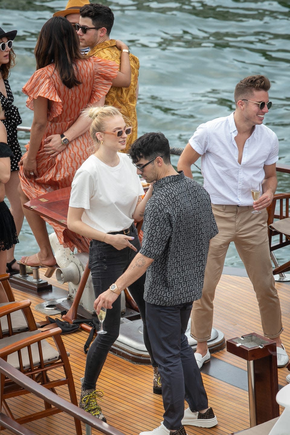 <p>Dancing on board a yacht together for their<a href="https://www.elle.com/uk/life-and-culture/wedding/a28182548/sophie-turner-joe-jonas-wedding-dress-pictures/" rel="nofollow noopener" target="_blank" data-ylk="slk:pre-wedding festivities in Paris." class="link "> pre-wedding festivities in Paris.</a></p>