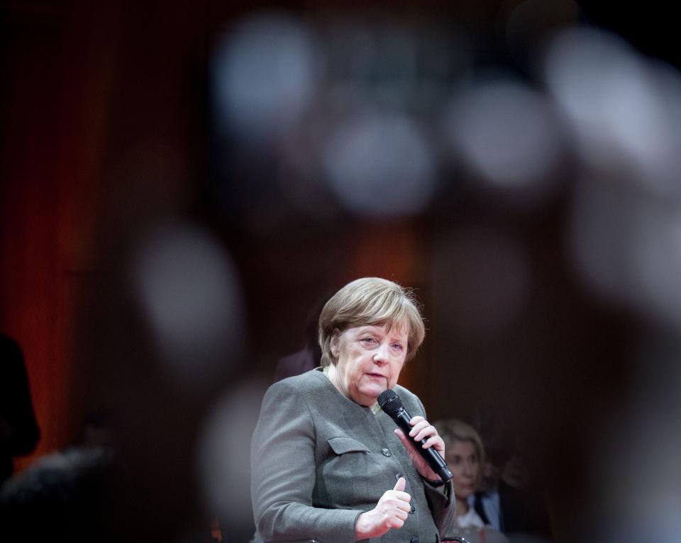 German chancellor Angela Merkel attends the 'Global Solutions Summit' in Berlin, Germany, Tuesday, March 19, 2019. Germany has launched an auction for frequencies in the future super-fast 5G network following a dispute over conditions imposed by authorities and questions over whether China's Huawei can supply equipment. (Kay Nietfeld/dpa via AP)