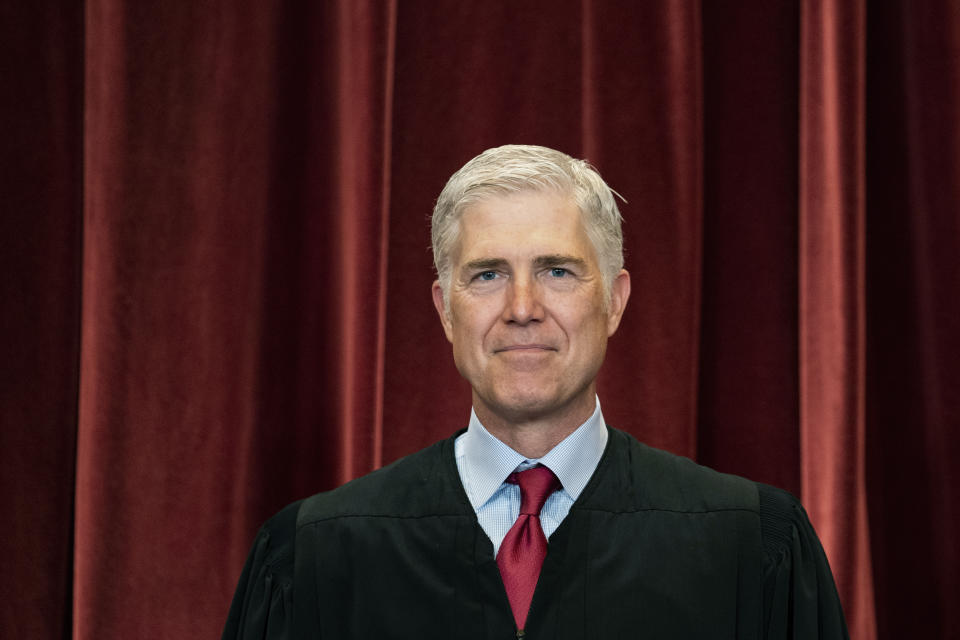 FILE - Associate Justice Neil Gorsuch stands during a group photo at the Supreme Court in Washington, April 23, 2021. (Erin Schaff/The New York Times via AP, Pool, File)