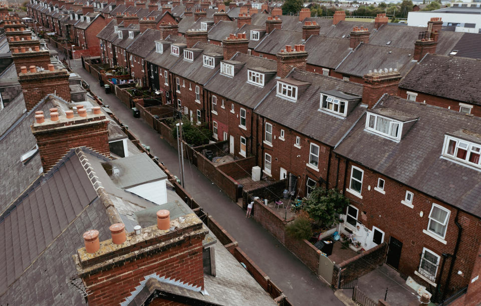 rent Leeds, UK - August 24, 2022.  Aerial view of the rooftops and houses of a run down Northern town in England during the UK Government's levelling up promise