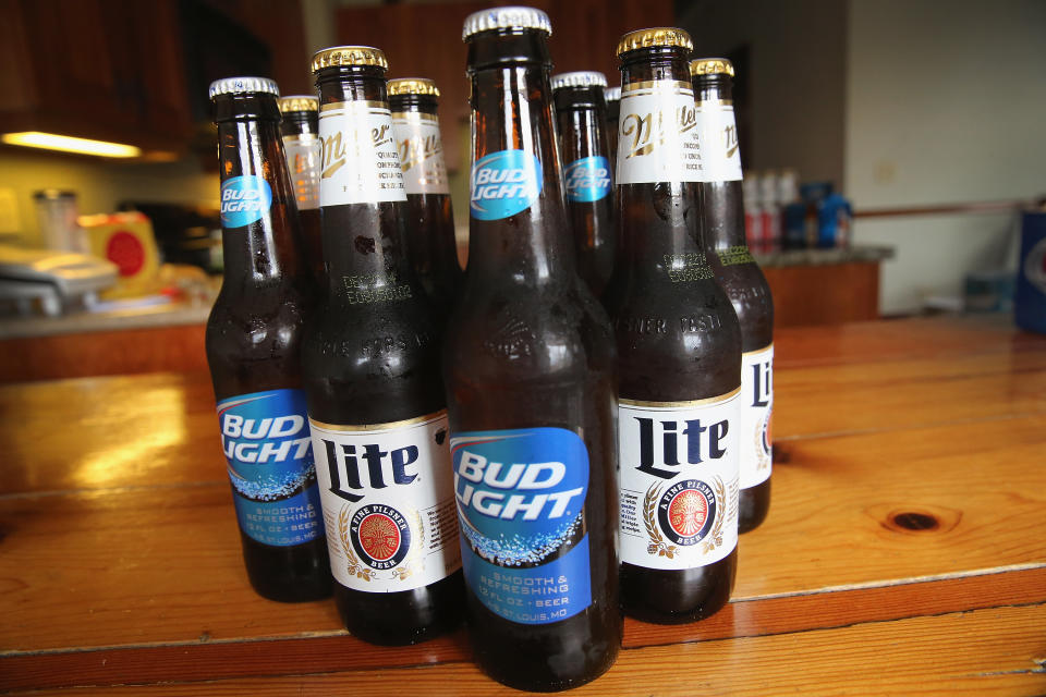 CHICAGO, IL - SEPTEMBER 15:  In this photo illustration, bottles of Miller Lite and Bud Light beer that are products of SABMiller and Anheuser-Busch InBev (respectively) are shown on September 15, 2014 in Chicago. Illinois. Shares of SABMiller have surged to an all-time high today on speculation of a takeover bid by Anheuser-Busch InBev, the world's largest brewer.  (Photo Illustration by Scott Olson/Getty Images)