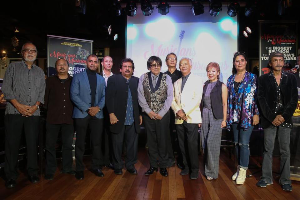 A small collection of musicians that will be playing on March 5, 2020 gather onstage to announce the Benefit concert.