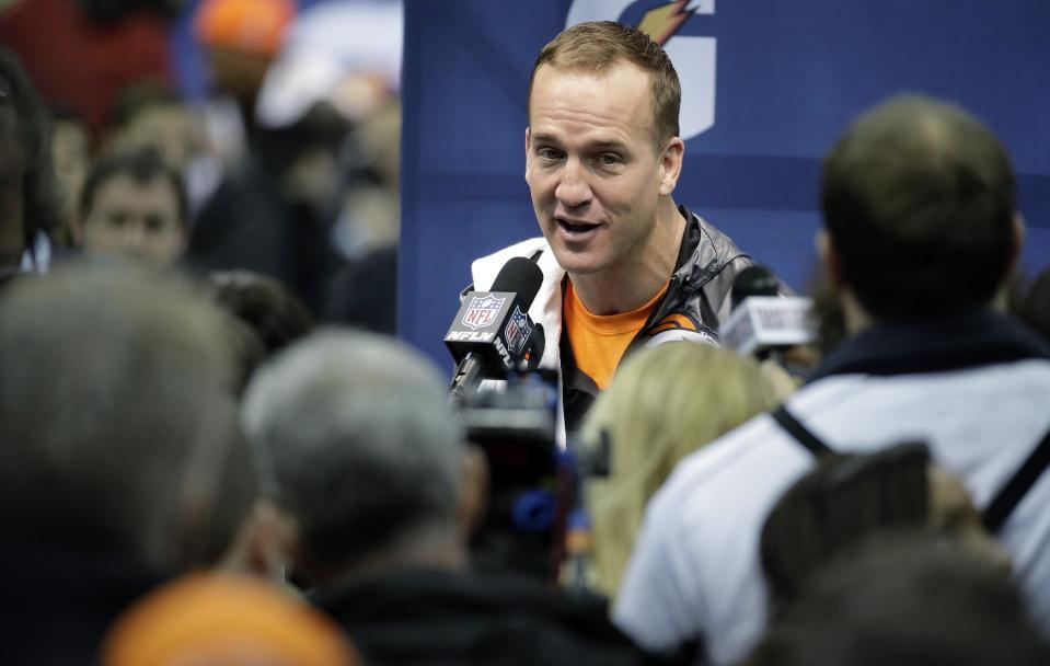 Denver Broncos' Peyton Manning answers questions during media day for the NFL Super Bowl XLVIII football game Tuesday, Jan. 28, 2014, in Newark, N.J. (AP Photo/Charlie Riedel)