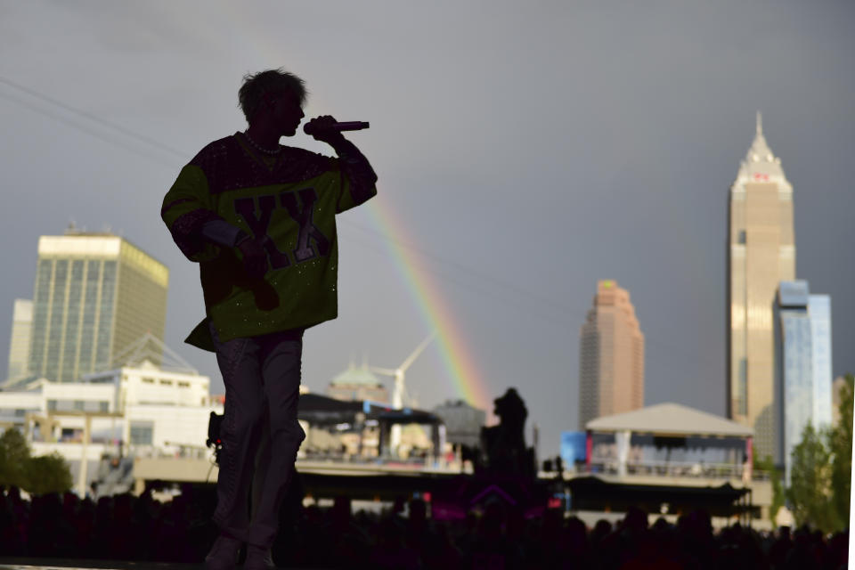 Machine Gun Kelly performs at the NFL Draft Theatre at the NFL football draft Saturday, May 1, 2021, in Cleveland. (AP Photo/David Dermer)