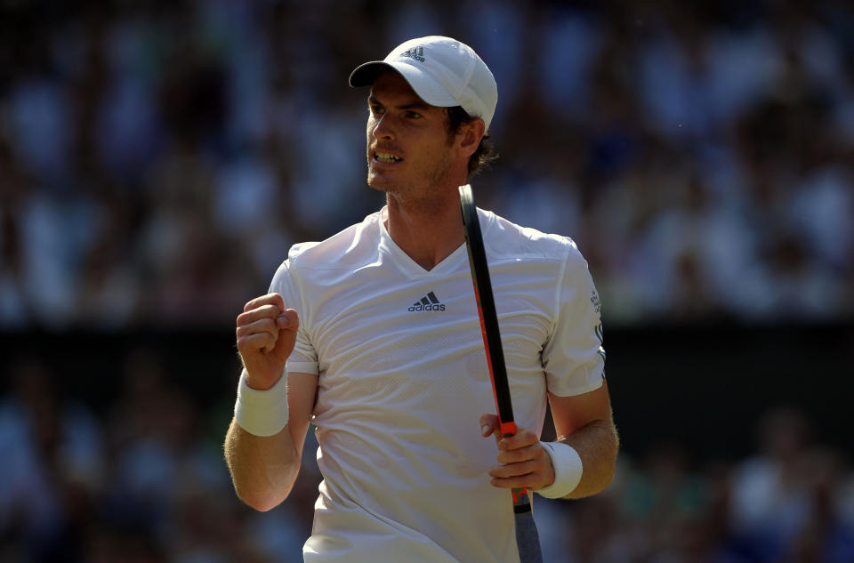 Great Britain's Andy Murray celebrates a point against Serbia's Novak Djokovic on day thirteen of the Wimbledon Championships at The All England Lawn Tennis and Croquet Club, Wimbledon.