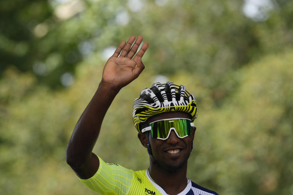 Eritrea's Biniam Girmay greets spectators prior to the first stage of the Tour de France cycling race over 206 kilometers (128 miles) with start in Florence and finish in Rimini, Italy, Saturday, June 29, 2024. (AP Photo/Jerome Delay)