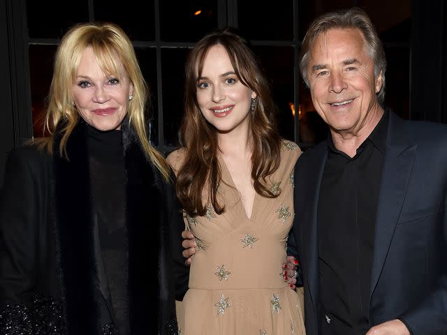 <p>Jamie McCarthy/Getty</p> Melanie Griffith, Dakota Johnson, and Don Johnson