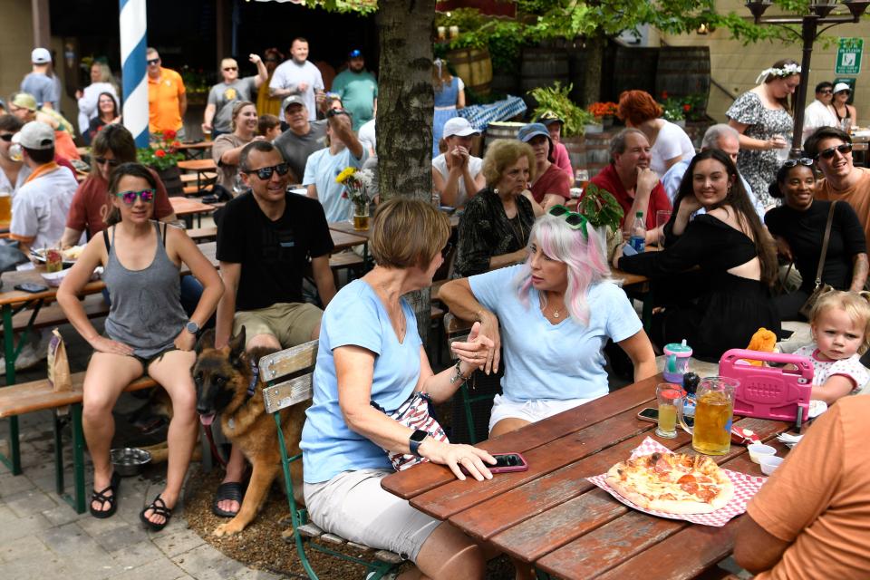 A beer garden filled with revelers during Schulz BrÃ¤u Brewing Company's 2nd Annual Maifest Saturday, May 13, 2023. 
