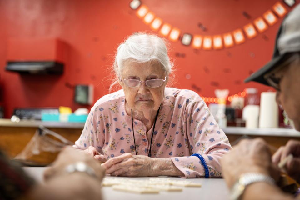 Mary Mesmer, then 90, plays Triominos at the Deaf and Hard of Hearing Center with other deaf community members on Oct. 10, 2023, in Corpus Christi, Texas.