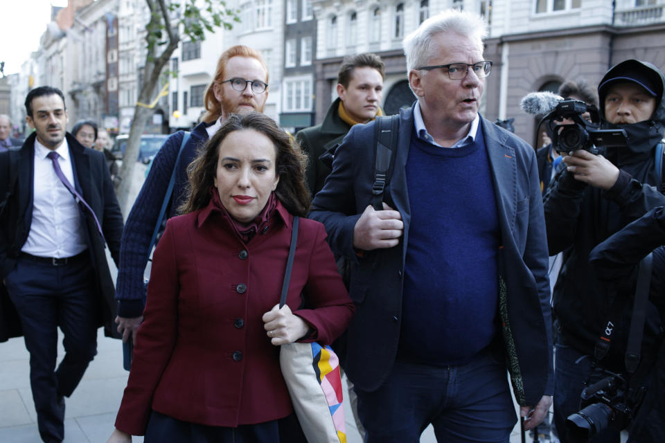 Stella Moris, partner of Julian Assange, arrives at the High Court alongside WikiLeaks editor-in-chief Kristinn Hrafnsson in London, Thursday, Oct. 28, 2021. The U.S. government is this week asking Britain's High Court to overturn a judge's decision that WikiLeaks founder Julian Assange should not be sent to the United States to face espionage charges. A lower court judge refused extradition in January on health grounds, saying Assange was likely to kill himself if held under harsh U.S. prison conditions. (AP Photo/David Cliff)