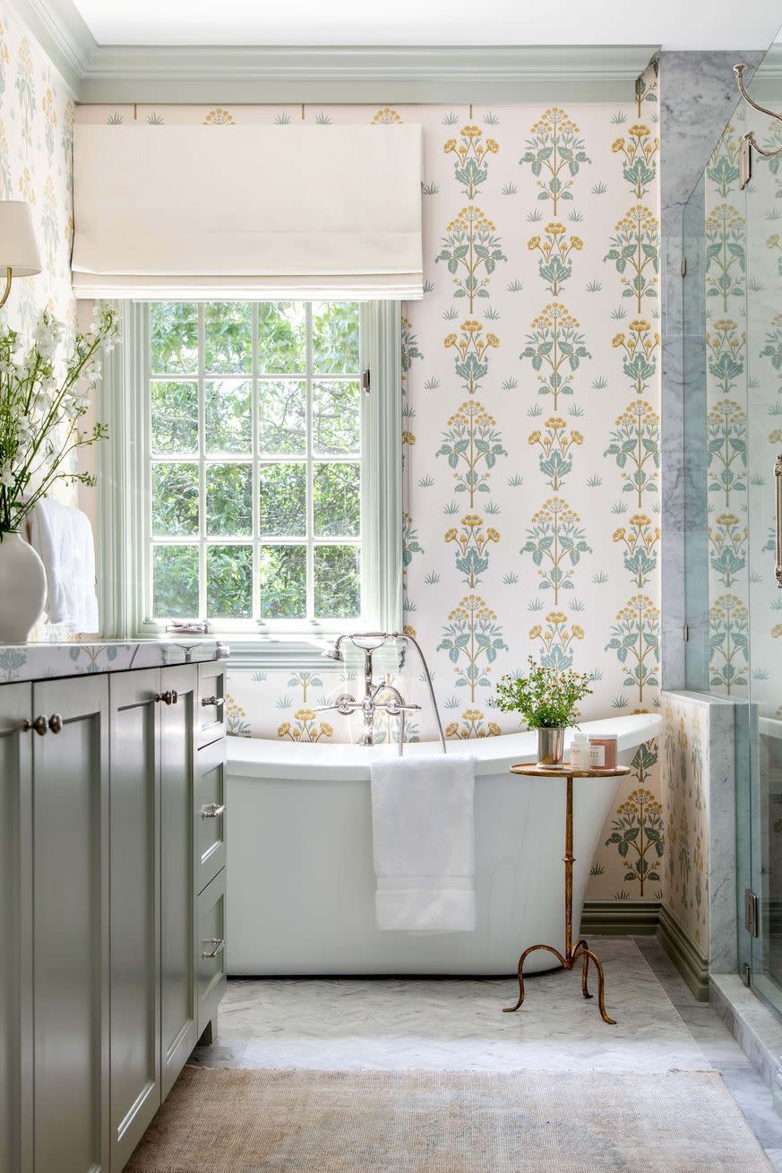 a bathroom with a tub and sink