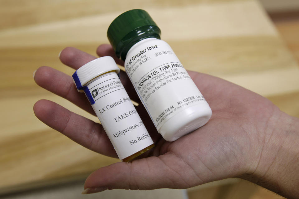 FILE - This Sept. 22, 2010 file photo shows bottles of abortion pills at a clinic in Des Moines, Iowa. The Food and Drug Administration on Thursday, Dec. 16, 2021 loosened some restrictions on the pill mifepristone, allowing it to be dispensed by more pharmacies. (AP Photo/Charlie Neibergall, file)