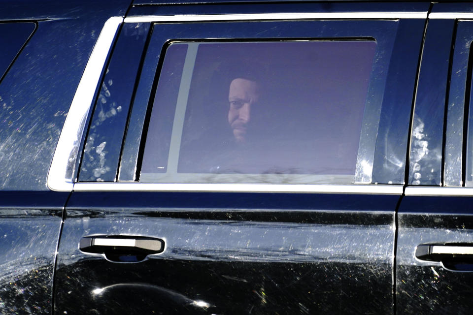 Ukrainian President Volodymyr Zelenskyy looks out as he is driven to the White House in Washington, Wednesday, Dec. 21, 2022. (AP Photo/Carolyn Kaster)