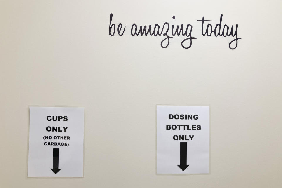 FILE - Signs at the Great Circle treatment center show where receptacles used to dispense methadone should be disposed of after use on Feb. 24, 2022, in Salem, Ore. Almost two years after Oregonians voted to decriminalize drugs and dedicate hundreds of millions of dollars to treatment services, the pioneering effort has been struggling to show progress. (AP Photo/Andrew Selsky, File)