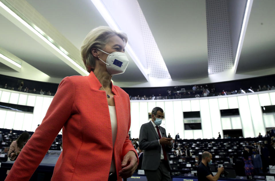 European Commission President Ursula von der Leyen walks in the chamber prior to delivering a State of the Union Address at the European Parliament in Strasbourg, France, Wednesday, Sept. 15, 2021. The European Union announced Wednesday it is committing 200 million more coronavirus vaccine doses to Africa to help curb the COVID-19 pandemic on a global scale. (Yves Herman, Pool via AP)