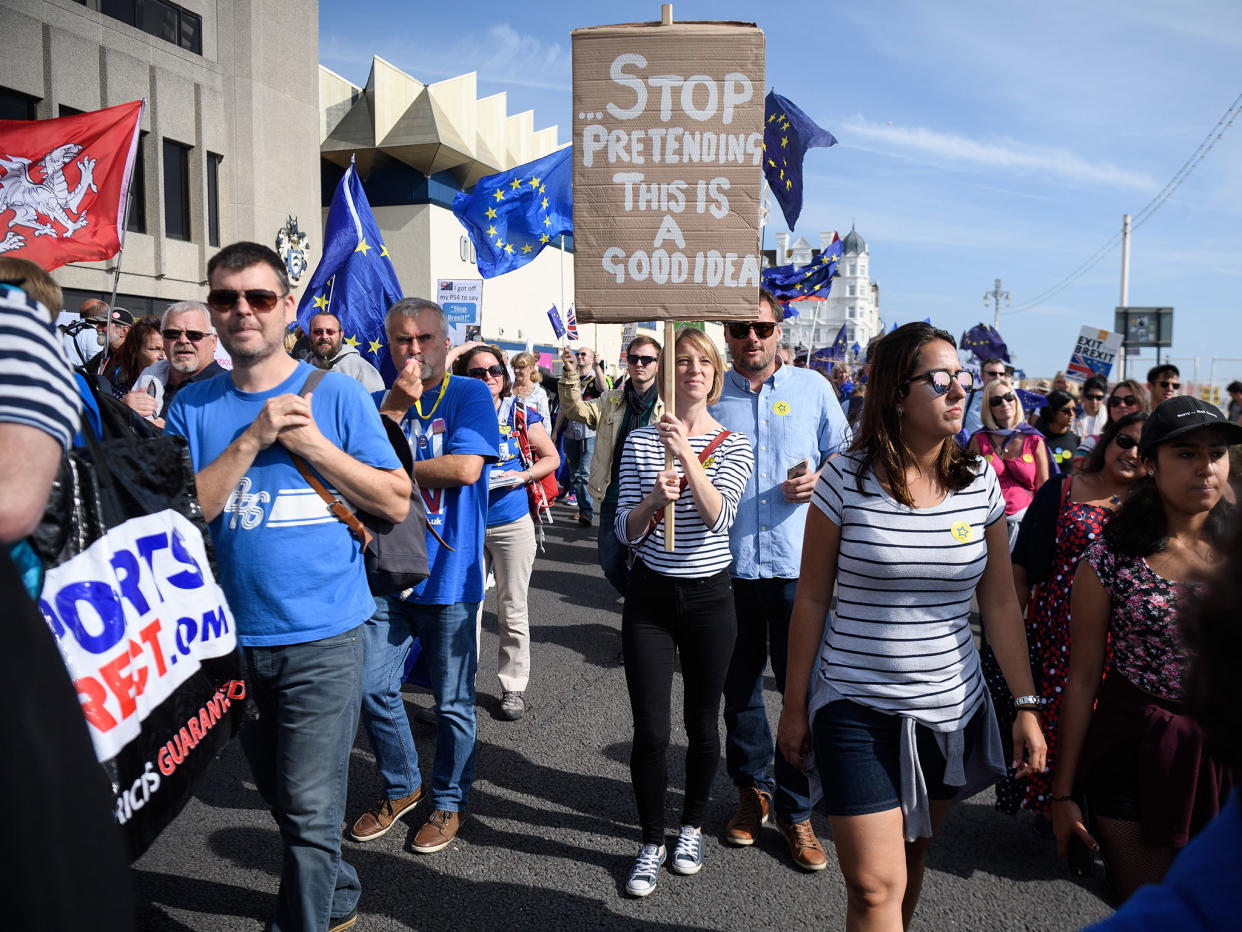 Pro-EU demonstrators march outside the main venue on the first day of the Labour Party conference: Getty