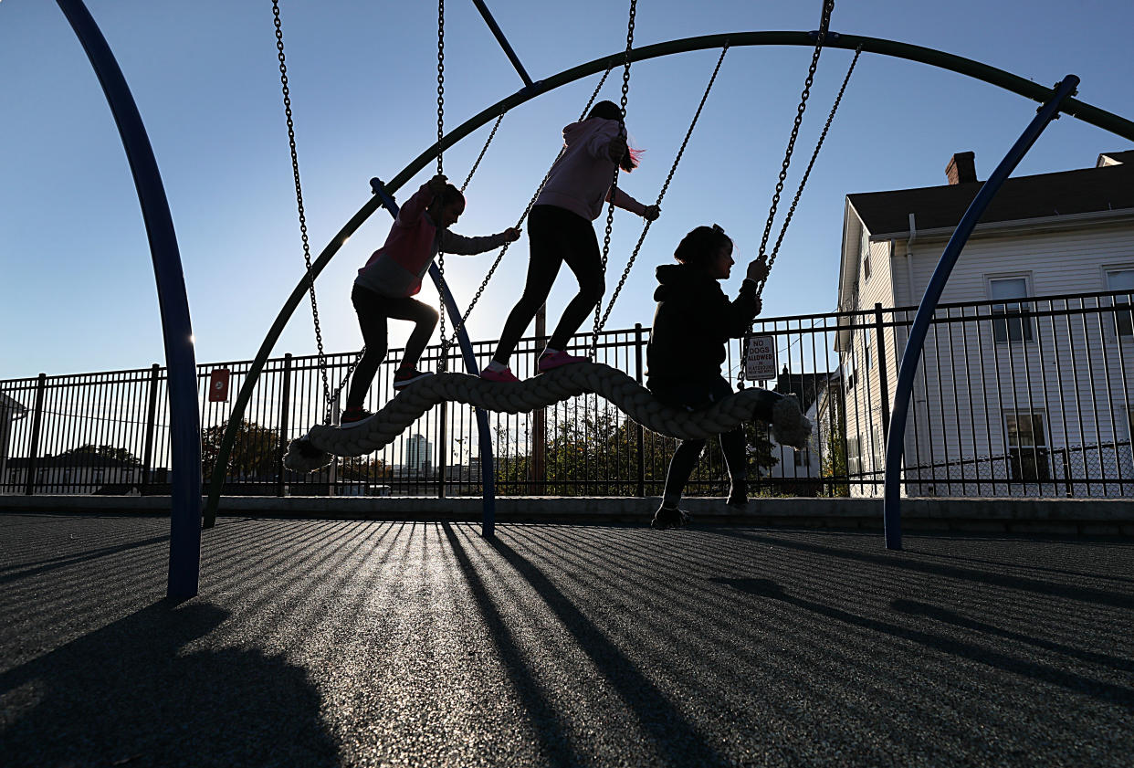 Worcester, MA - October 19: As the sun settled low in the sky, silhouettes of children playing formed at the Betty Price Playground in Worcester, MA on October 19, 2021. (Photo by Suzanne Kreiter/The Boston Globe via Getty Images)