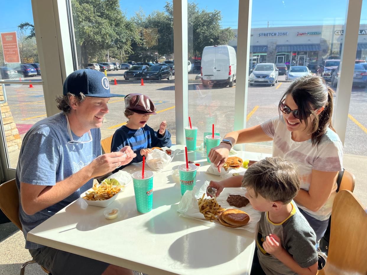 Kris, 9-year-old Jude, 3-year-old Quinn and Danie White dine at P. Terry's on Saturday during Giving Back Day, which raises money for the Statesman's Season for Caring program. The family didn't know it was a Giving Back Day but came because Quinn wanted to eat lunch there.