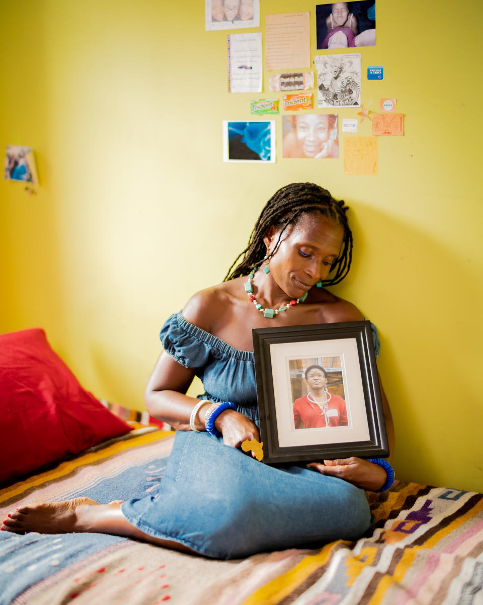 Dionne Monsanto holds a portrait of her daughter, Siwe, in the girl's bedroom in New York City, on Sept. 9, 2020. Siwe, 15, died by suicide in 2011.Elias Williams for TIME